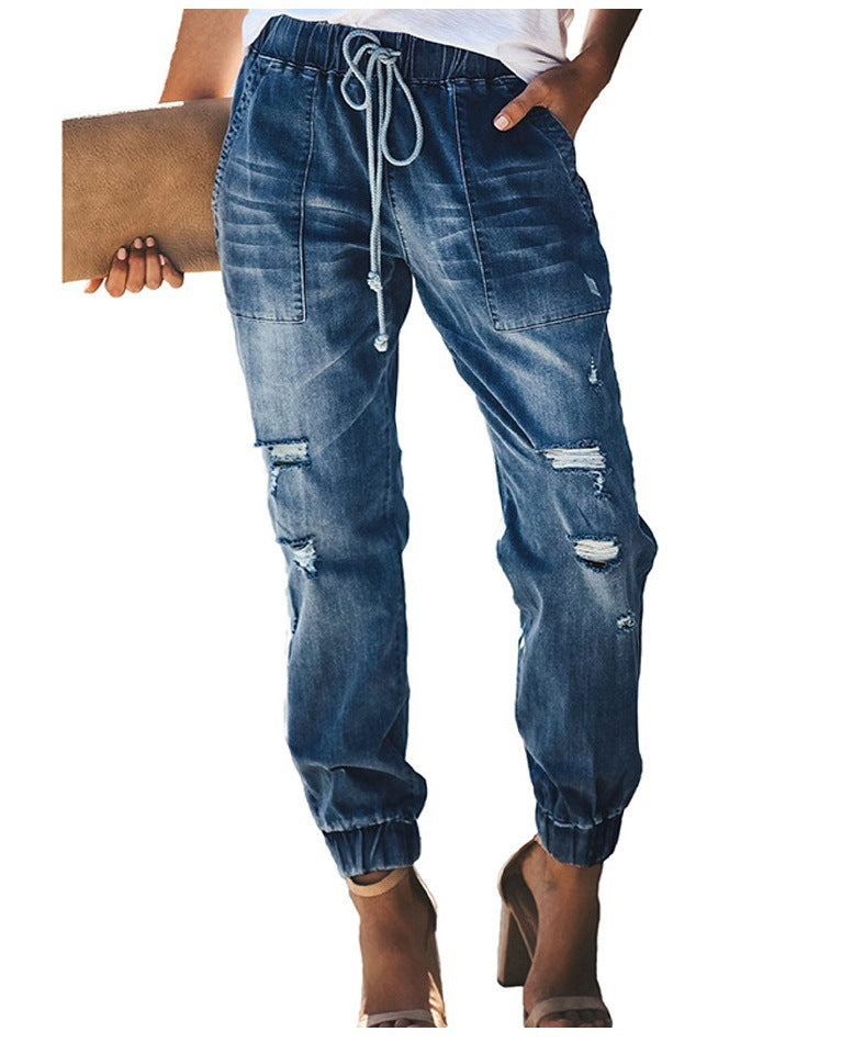 Lockere, schmale High-Waist-Jeans mit Rissen und Kordelzug